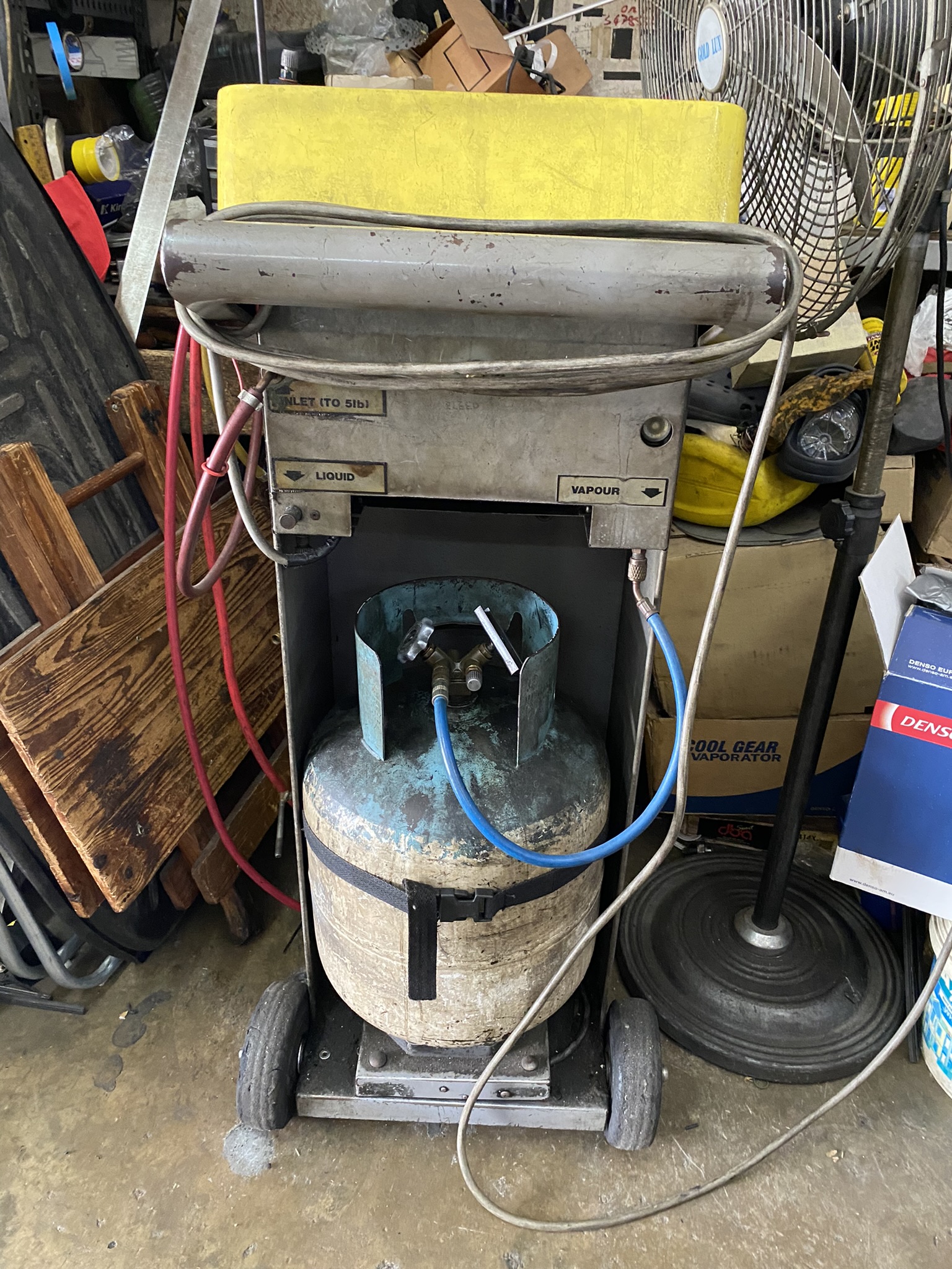 Free recovery machines like this one, in a Malaysian auto repair shop, are now in disrepair. Mechanics don't always have the money to replace them. Photo: Tilden Chao, 2023.